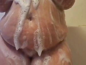 Plus-size sandy-haired soaps up